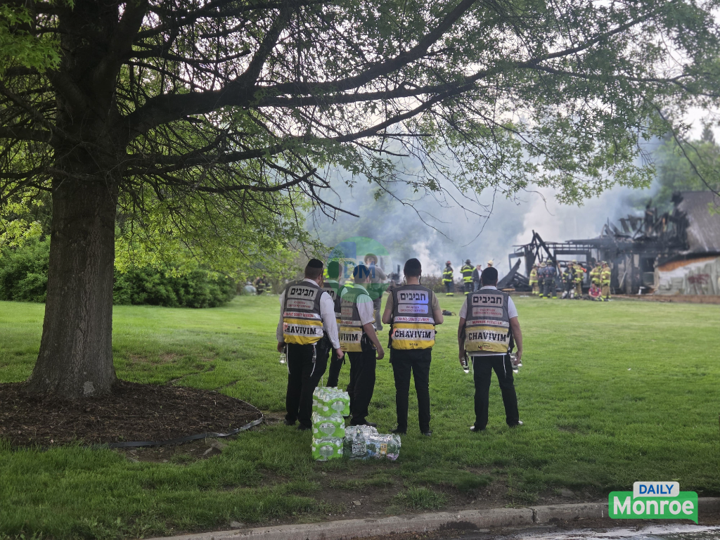 Firefighters working at the Campbell Hall structure fire