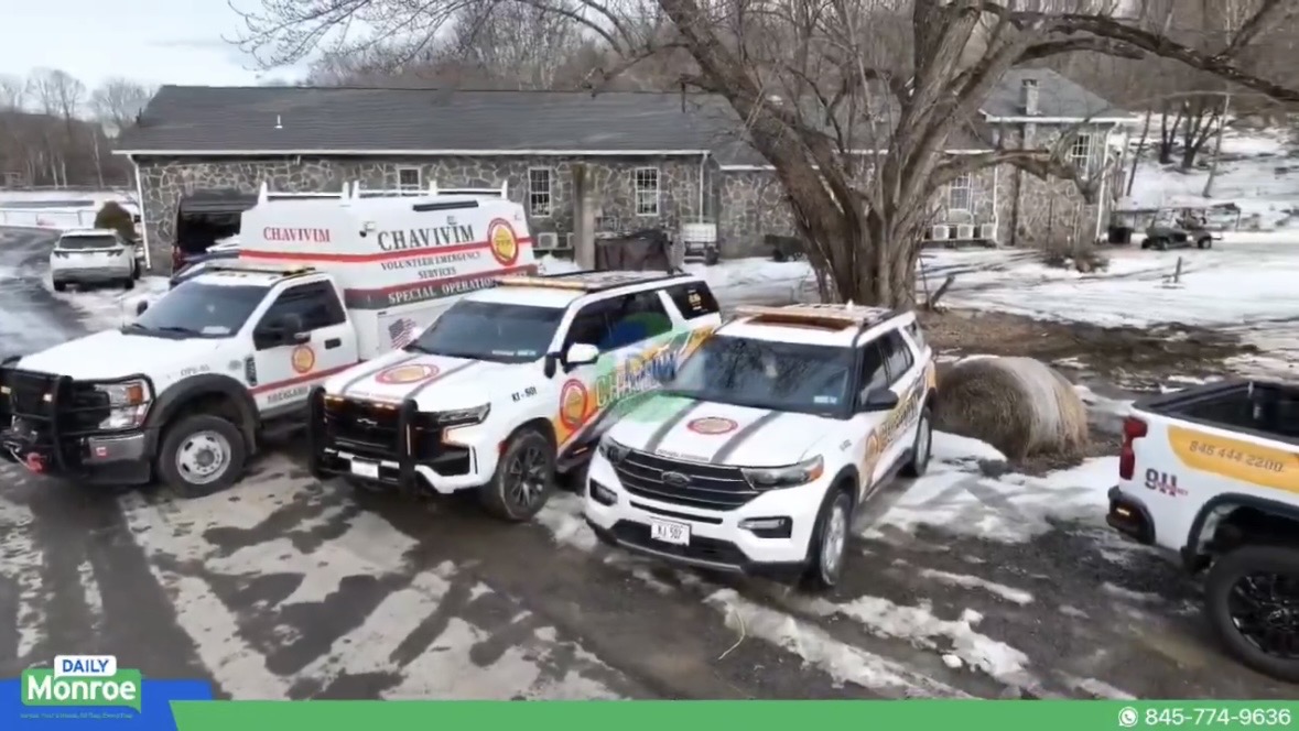 Aerial view of the Chavivim fleet lineup including vehicles from multiple divisions at the ribbon cutting event