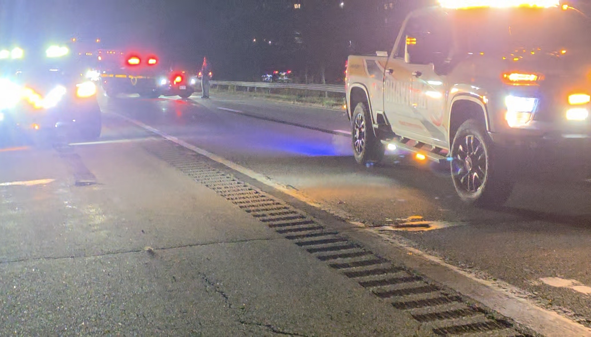 Orange County Chavivim recovery truck and NY State Police vehicle parked on the Route 17 shoulder during trailer reattachment