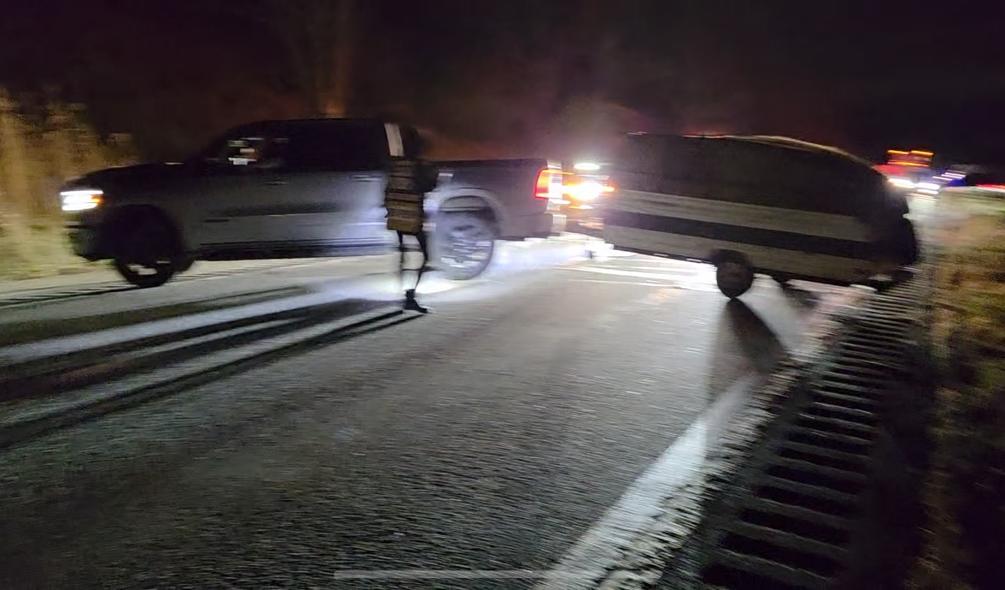Detached travel trailer separated from its tow vehicle on Route 17 at night